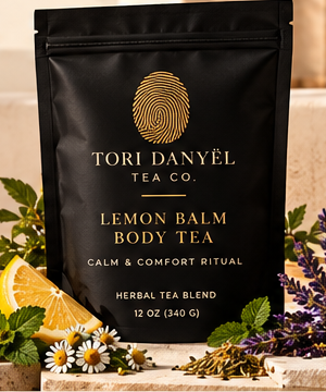 Lemon Balm Body Tea black tea pouch with the gold Tori Danyël Tea Co. fingerprint branding, as shown in the collection photograph