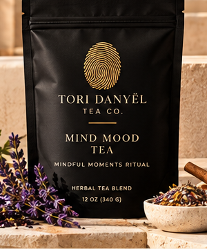 Mind Mood Tea black tea pouch with the gold Tori Danyël Tea Co. fingerprint branding, as shown in the collection photograph