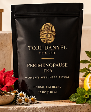 Perimenopause Tea black tea pouch with the gold Tori Danyël Tea Co. fingerprint branding, as shown in the collection photograph