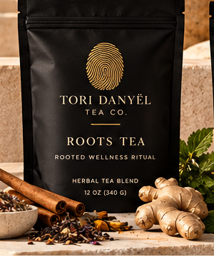 Roots Tea black tea pouch with the gold Tori Danyël Tea Co. fingerprint branding, as shown in the collection photograph